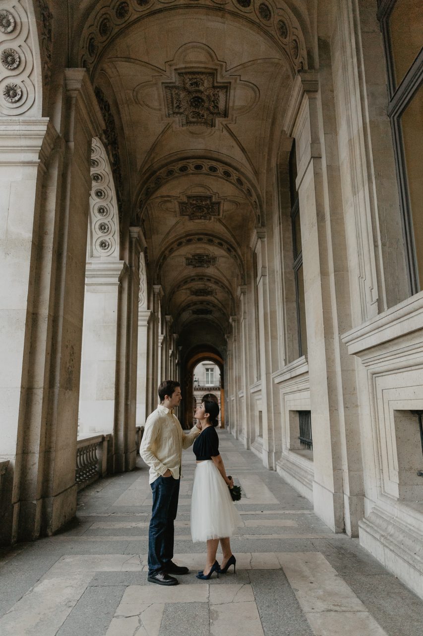 3Q1A2077-853x1280 Paris under the rain Weddings & Couples couple louvre couple paris rain Couple Photography in Paris elopement photography paris engagement photography paris in the rain pont du carrousel pre wedding paris rain paris Wedding Photographer in Paris