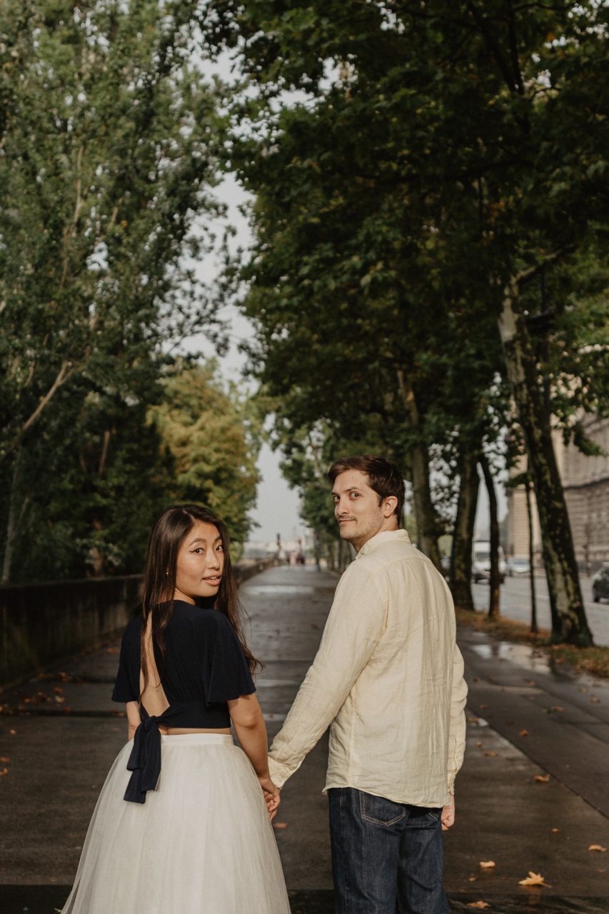 3Q1A2503-853x1280 Paris under the rain Weddings & Couples couple louvre couple paris rain Couple Photography in Paris elopement photography paris engagement photography paris in the rain pont du carrousel pre wedding paris rain paris Wedding Photographer in Paris